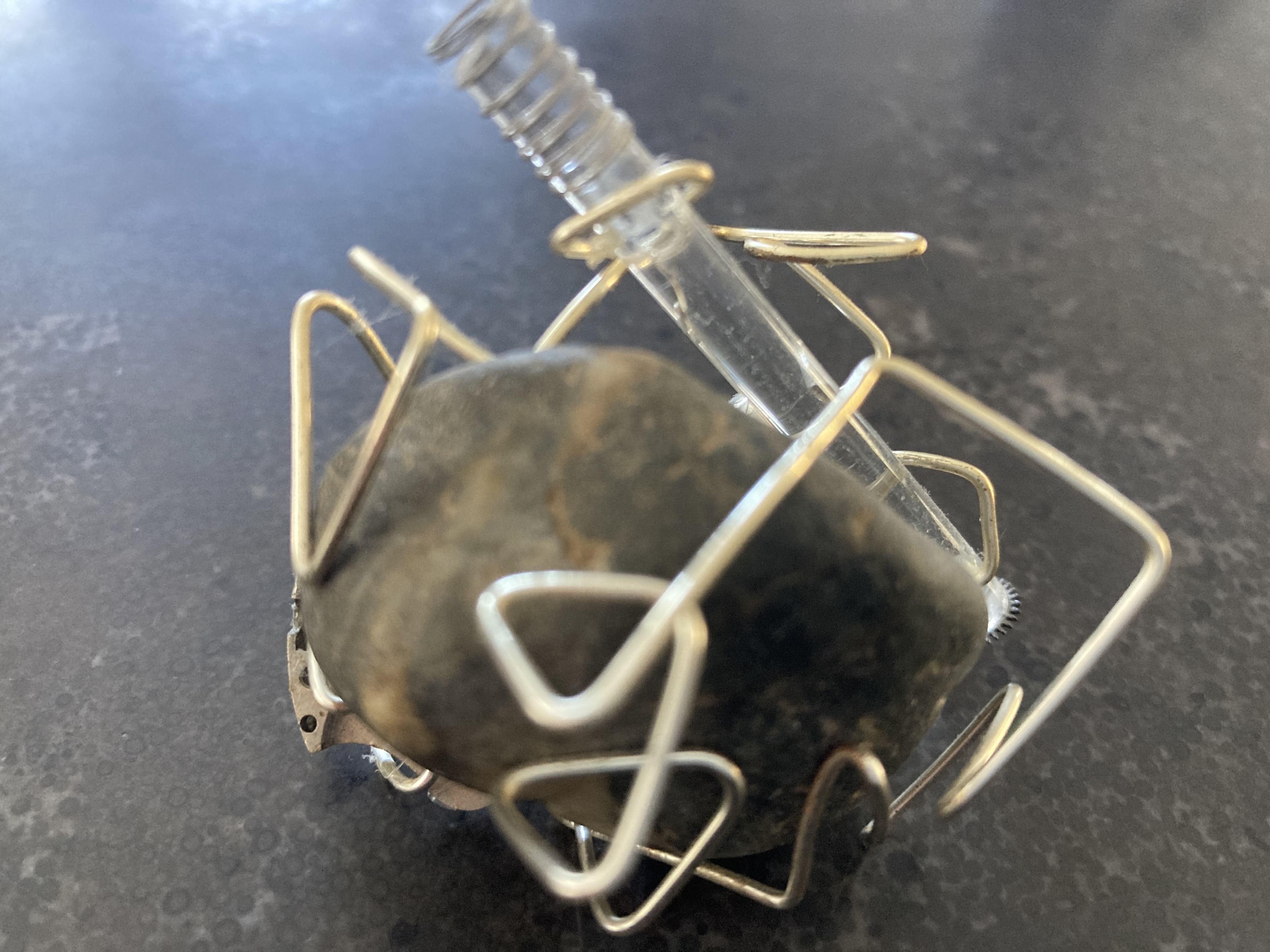 sculpture made of rock, glass, wire and beads 